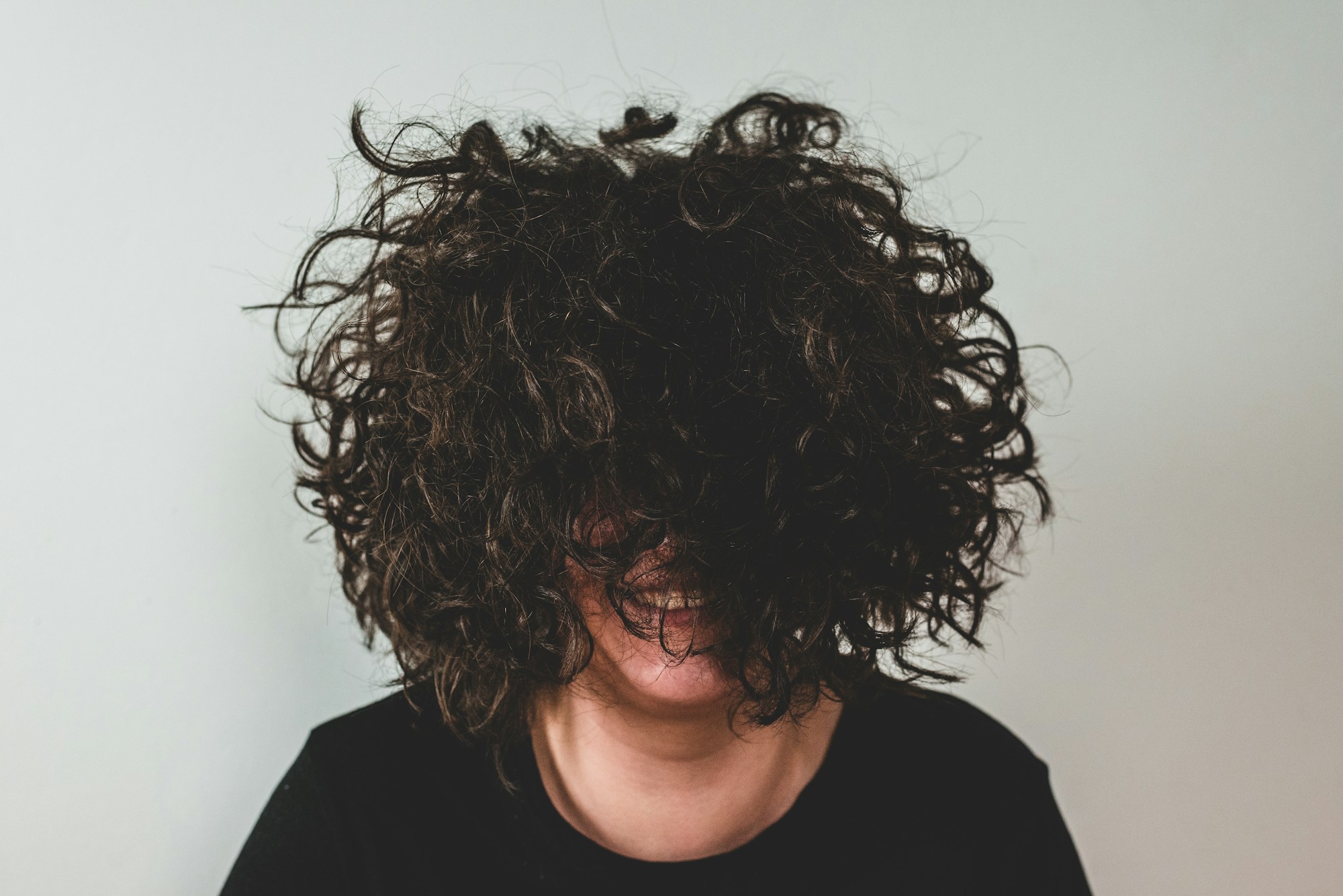 Editorial portrait of a woman with natural curls